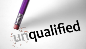 A pencil erasing “un” from the word “unqualified” to leave “qualified.”