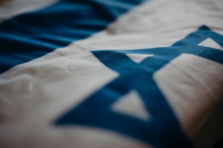 An Israeli flag with a blue Star of David.